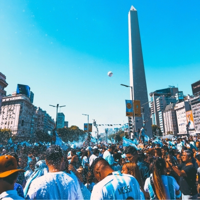 People with Argentinian Flag and Wearing Football T-shirts Celebrating in City